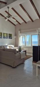 a bedroom with a bed and a ceiling fan at Casa Bella Vista in Moraira