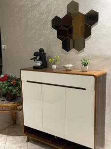 a table with a coffee maker on top of it at Luxurious apartment in Chefchaouene