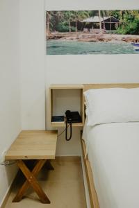 Postel nebo postele na pokoji v ubytování Hotel Plataneras Plaza