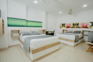 Postel nebo postele na pokoji v ubytování Hotel Plataneras Plaza