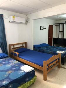 Postel nebo postele na pokoji v ubytování Casa Santorini II