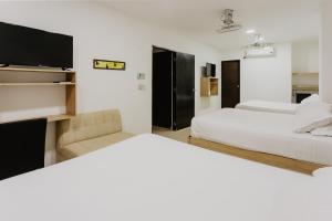 Postel nebo postele na pokoji v ubytování Hotel Plataneras Plaza