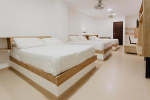 Postel nebo postele na pokoji v ubytování Hotel Plataneras Plaza