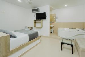 Postel nebo postele na pokoji v ubytování Hotel Plataneras Plaza