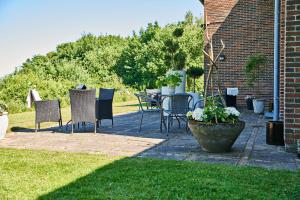 a patio with chairs and a table in a yard at Danhostel Horsens in Horsens