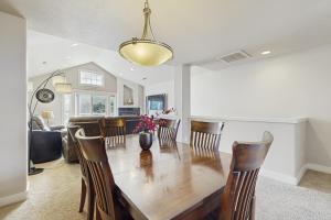 a dining room and living room with a table and chairs at A Place away from the Pace in Rockaway Beach