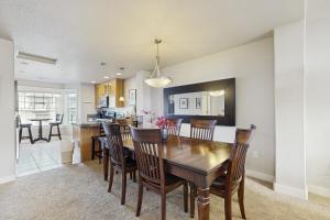 a dining room and kitchen with a table and chairs at A Place away from the Pace in Rockaway Beach +22 photos