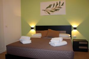 Letto o letti in una camera di L'Ulivo in Centro