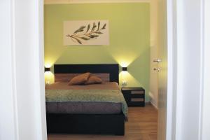 Letto o letti in una camera di L'Ulivo in Centro