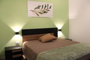 Letto o letti in una camera di L'Ulivo in Centro