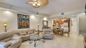 a living room with a couch and a table at 609 Mariners Club in Key Largo