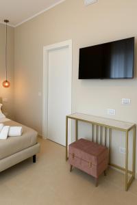 TV a/nebo společenská místnost v ubytování Maison ì room & suites