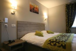 Postel nebo postele na pokoji v ubytování Parc Hôtel