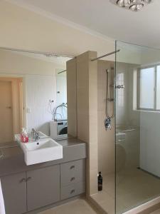 a bathroom with a sink and a shower at Heavenly Hawley in Hawley Beach +33 photos