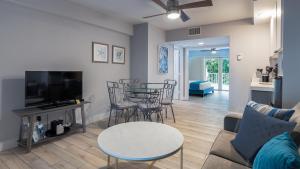 a living room with a couch and a table at 610 Mariners Club in Key Largo