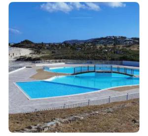 a large swimming pool on top of a hill at Studio TiLagon in Cul de Sac