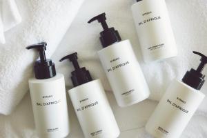 a group of four bottles of hair products on a counter at ANA InterContinental Manza Beach Resort by IHG in Onna