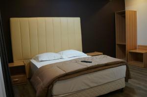 Postel nebo postele na pokoji v ubytování Hotel Evergreen