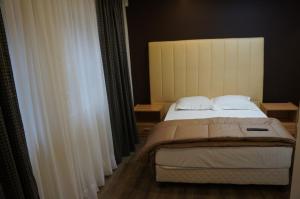 Postel nebo postele na pokoji v ubytování Hotel Evergreen
