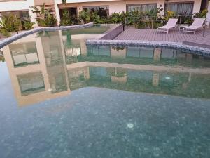 a large pool of water in a building at Panoramic ocean view appartement in Casablanca