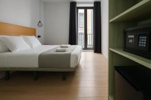 Postel nebo postele na pokoji v ubytování CH Lemon Rooms - Madrid