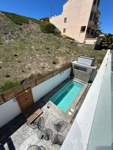a swimming pool on the side of a building at Casa de Nicolás in Zirándaro