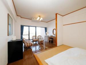 Postel nebo postele na pokoji v ubytování Resort Hotel Umibe no Kajuen
