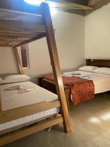 a bedroom with two bunk beds in a room at BYMAR Resort in Necoclí