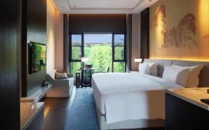 Letto o letti in una camera di 西安曲江芳林苑酒店