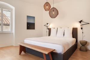Postel nebo postele na pokoji v ubytování Pomalo Inn