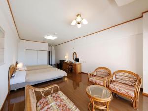 Postel nebo postele na pokoji v ubytování Resort Hotel Umibe no Kajuen