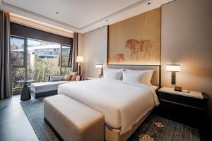 Letto o letti in una camera di 西安曲江芳林苑酒店