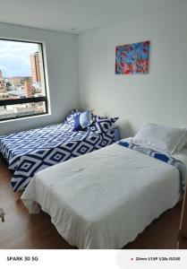 Ένα ή περισσότερα κρεβάτια σε δωμάτιο στο Apartamento Central Corferias