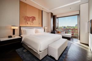 Letto o letti in una camera di 西安曲江芳林苑酒店
