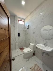 a white bathroom with a toilet and a sink at Bophut Fisherman's Village Pink Sky Villa in Koh Samui  +39 photos