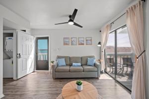 a living room with a couch and a table at Vitamin Sea in Gulf Shores