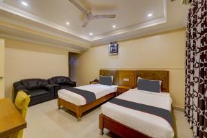Postel nebo postele na pokoji v ubytování Super Hotel O G Silver Ashok Nagar