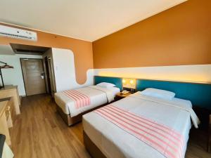 Postel nebo postele na pokoji v ubytování Asia Cha-am Hotel