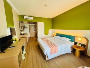 Postel nebo postele na pokoji v ubytování Asia Cha-am Hotel