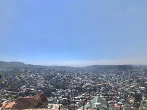 a view of a city from the top of a building at Elatap Studio Overlooking Baguio in Baguio