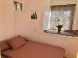a small room with a couch and a window at Elatap Studio Overlooking Baguio in Baguio