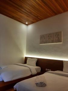 Postel nebo postele na pokoji v ubytování Lantis ViBES Inn