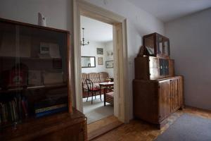a living room with a television and a living room with a table at Apartment History in Zagreb +44 photos