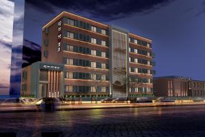 a rendering of a hotel building at night at Happy Dragon Universal Vacation Hotel - close to Universal Studio and Wanda Plaza,free shuttle to the Resort,Free Coffee,Laundry in Beijing