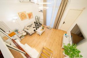 Area soggiorno di 柃居 B&B - Huaihai Middle Road Branch