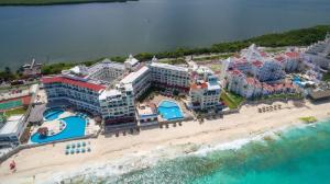 an aerial view of a resort on the beach at “Magic Sunrise at Cancun” in Cancún