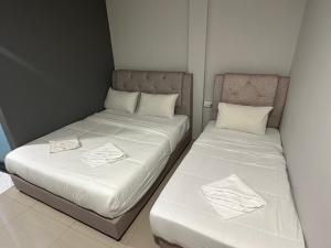 Postel nebo postele na pokoji v ubytování Georgetown Hotel