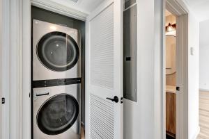 two washer and dryer machines in a room at South Beach Living #1 in Imperial Beach