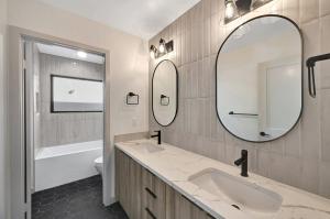 a bathroom with a sink and a mirror at South Beach Living #1 in Imperial Beach +2 photos