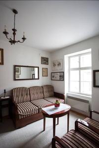 a living room with a couch and a table at Apartment History in Zagreb
